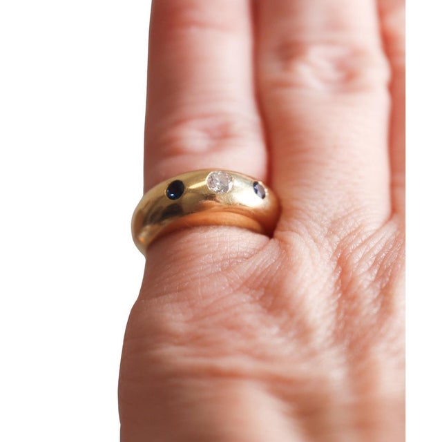 Vintage Cartier 18K Gold with Diamond and Sapphire Dome or Gypsy Ring. Ring features a dome-form band centered by an...