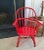 Now painted red, this child's windsor chair is sturdy and ready for use. It measures 16 inches wide by 12 inches deep by...