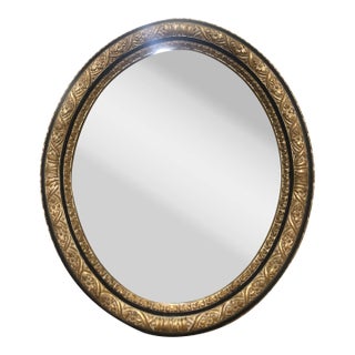 Italian Oval Mirror With Hand-Carved Floral Motifs in Gold-Leaf For Sale