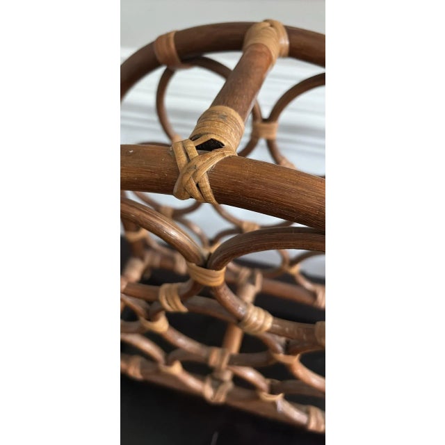 Bentwood rattan wine rack. Holds 8 bottles.