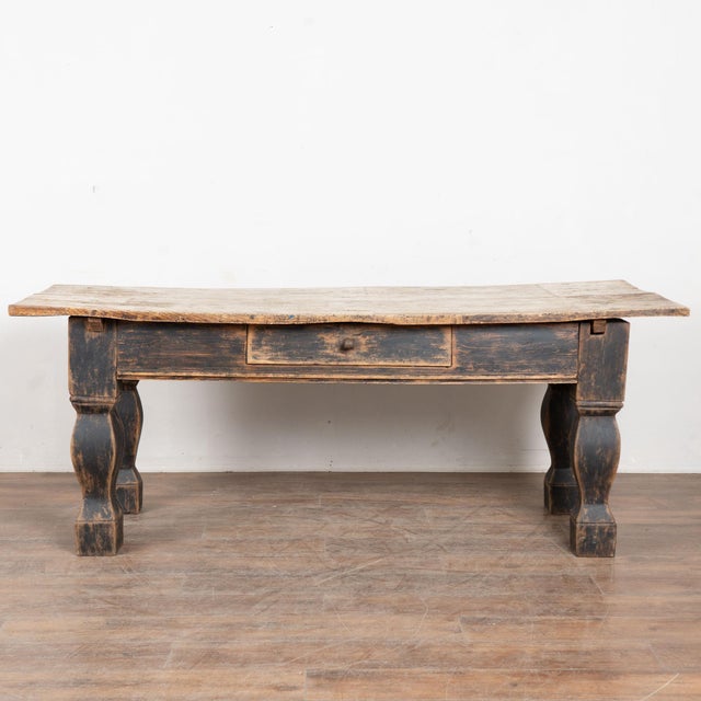 Late 18th century Danish Baroque table, crafted in oak. This console table features a single drawer along the front skirt...