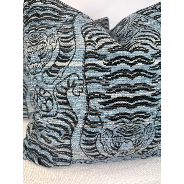 Custom pair of 22" pillows covered in a blue chenille fabric in a Tibetan tiger pattern. These pillows have tapered corner...