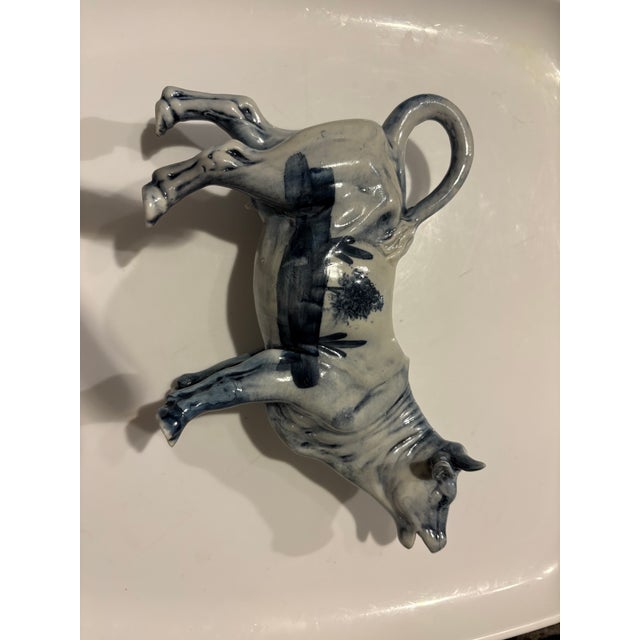 Vintage Dutch Delft Blue Ceramic Cow Creamer Jug features hand-painted blue and white scenes of Dutch windmills and...