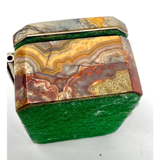 A pretty set of 2 decorative boxes. The first is a stunningly grained agate little box. It is colorful and vibrant. It is...