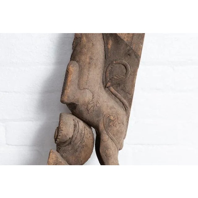 An antique hand carved Indian architectural carving from Gujarat from the early 20th century, depicting a mythological...