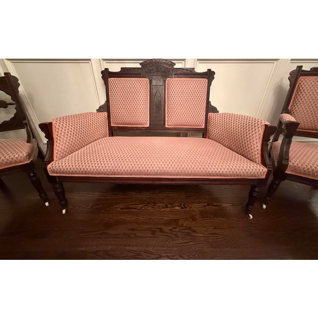 Offered by Mission Opaline, this exquisite 3-piece Antique American Victorian parlor suite is a stunning example of the...