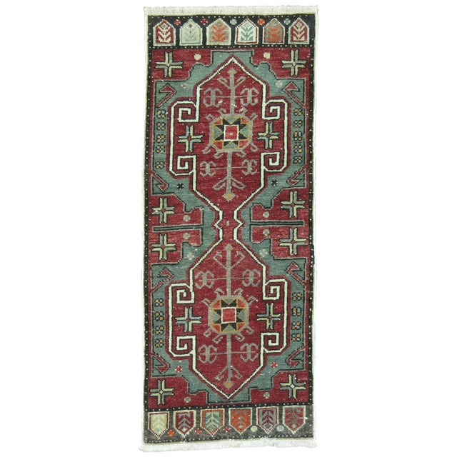 A vintage Anatolian Turkish Yastik rug mat in pretty green and reds. 1'5'' x 3'5''