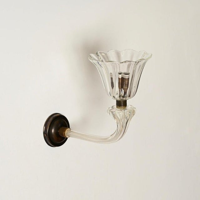 Magnificent and unique large pair of bellflower-shaped sconces in murano mouth-blown glass and solid brass with a stunning...