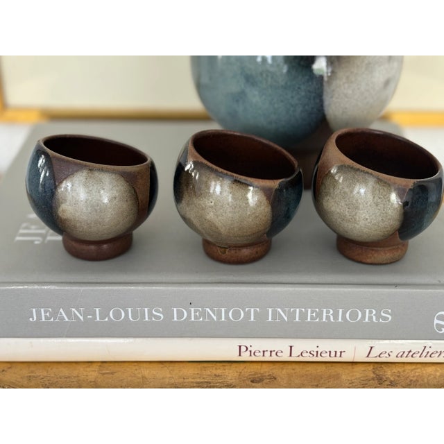 Lovely color palette on this sake set. The decanter is a versatile piece of pottery that could also be used for a vase or...