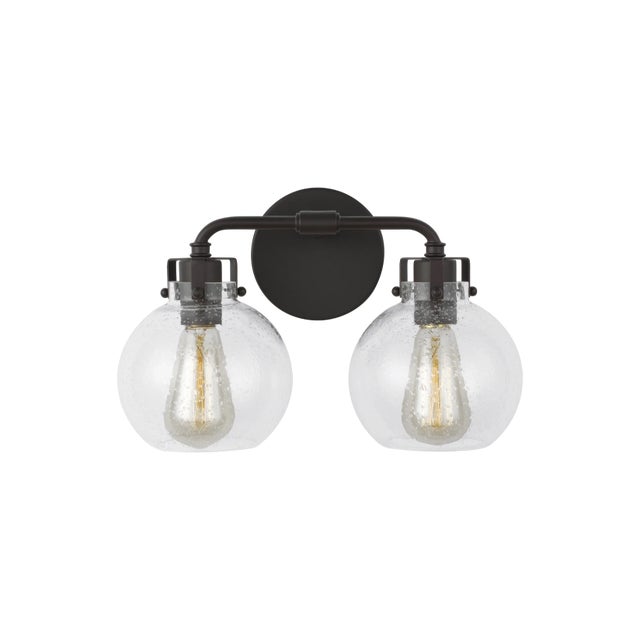 Clara features Clear Seeded glass shades that subtly diffuse the lamping while allowing the exposed bulb to be a central...