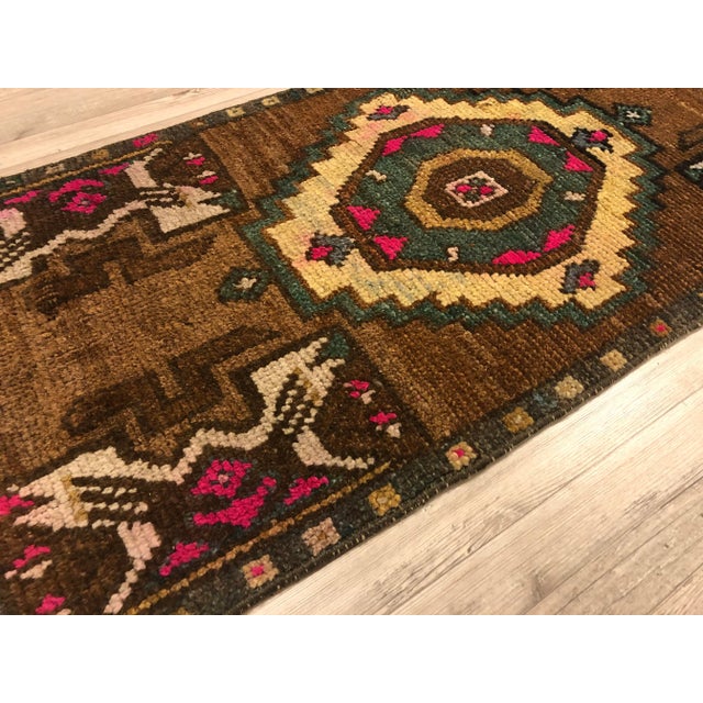 This is a vintage Turkish Anatolian kilim rug from the 1960s. The piece was hand-woven.