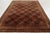 This 8x11 antique Tetex rug, hand-hooked in wool circa 1920–1929, features an allover field of geometric gul motifs framed...