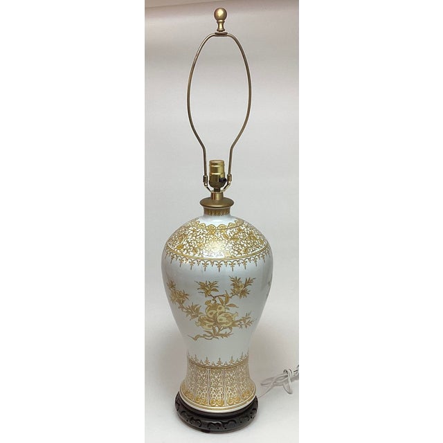 Oversized Mid-Century Porcelain Table Lamp with Gold Pomegranate Motif A striking large mid-century table lamp featuring a...