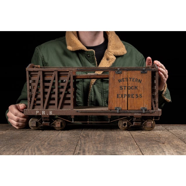 Antique handmade scale model of a railroad stock car constructed primarily of wood with metal and wire components. Modeled...