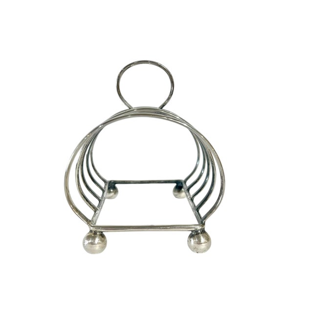 Antique English Sheffield plate toast rack. Marked England and with the maker’s mark of Israel Freeman and Son Ltd.