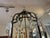This product is a large French-style metal lantern with frosted glass panels, designed in an antique reproduction style....