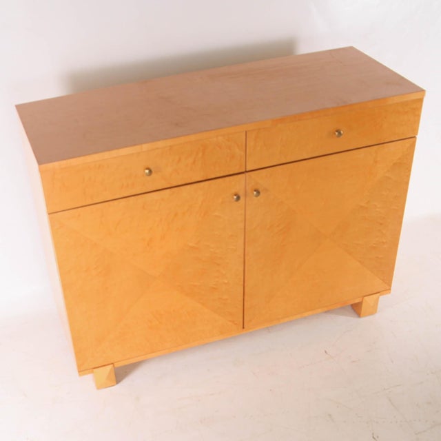 Rare vintage Art Deco sideboard in speckled maple. Featuring two drawers and two doors, this sideboard impresses with its...