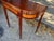This antique Federal style game table is made of mahogany with satinwood inlay, showcasing intricate craftsmanship and a...