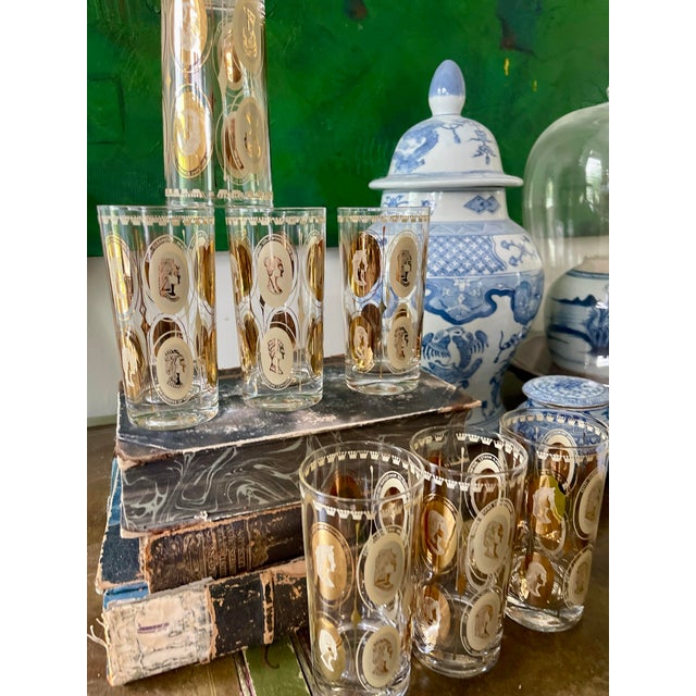 Fabulous set of seven highly sought after tall boy glasses or tumblers, each presenting royal ladies in gold, such as...