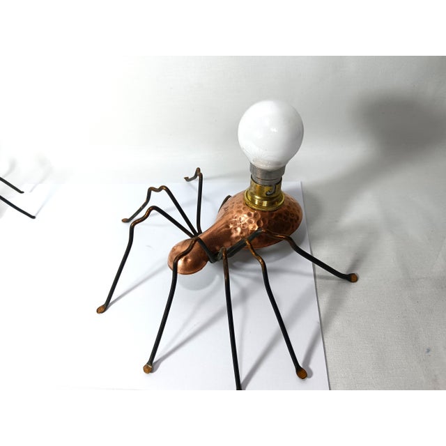 Two charming lamps, handmade, hammered copper and wrought iron, elegantly complemented with opaline bulbs. Of different...