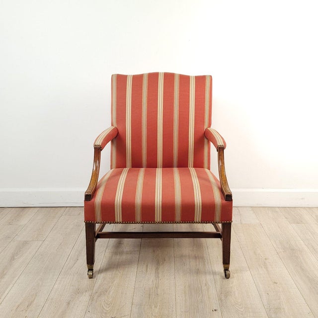 A George III mahogany library chair, England circa 1800. Seat height 17".