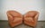 Pair of 1980's Post Modern Art Deco swivel lounge chairs for sale. These are in pink leather, and are in great condition....