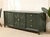 A striking vintage credenza refinished in a deep, moody green with crisp brass-tone hardware for just the right hit of...