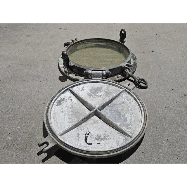 This large brass nautical porthole window is a stunning piece of maritime history that will make a beautiful addition to...
