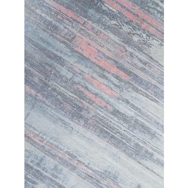 Beautiful hand knotted modern and fashionable collection of borderless designs rug, made of wool & silk. This extremely...