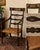 Elegant English Regency-style armchair featuring a beautifully distressed black crackle finish with hand-stenciled gilt...