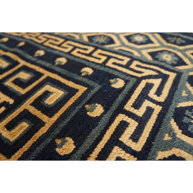 Antique Baotou Chinese Medallion Knotted Rug, Circa Date: 1920s. This exemplary piece is characteristic of the Baotou...