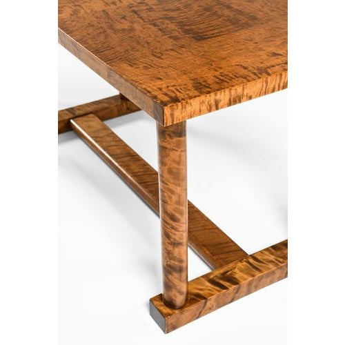 This very rare library table, designed by carl malmsten and produced in sweden during the 1920s, exemplifies the quiet...