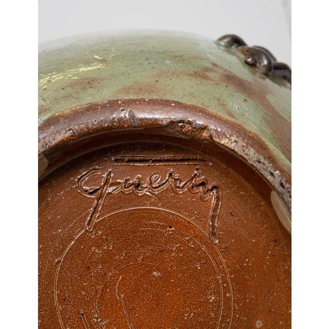 Stunning large vase ,Beautiful color .stitched detailing, signed by Roger Guèrin (1896-1954) was one of the most important...