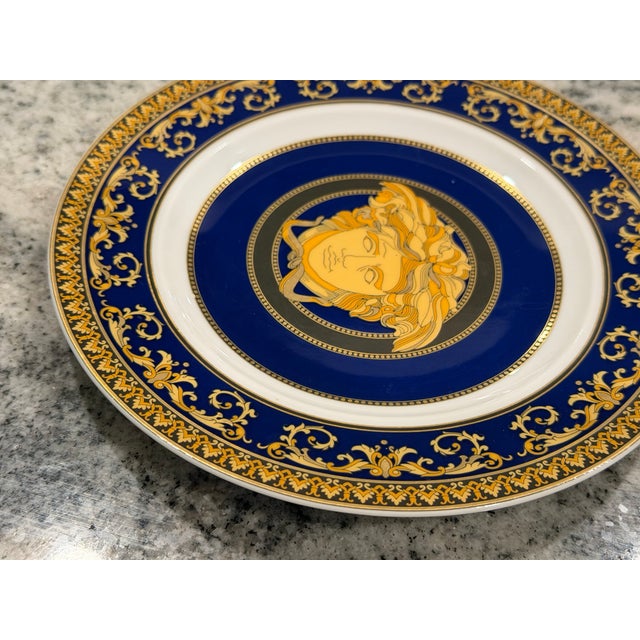 Elegant Rosenthal meets Versace Medusa Blue bread and butter plate featuring the iconic gold Medusa head against a rich...