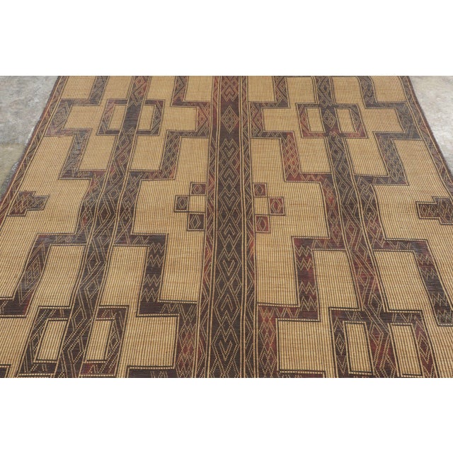 This vintage Moroccan mat is a primitive 6x13 Tuareg runner from the nomadic tribe of the same name. Handwoven with reeds...