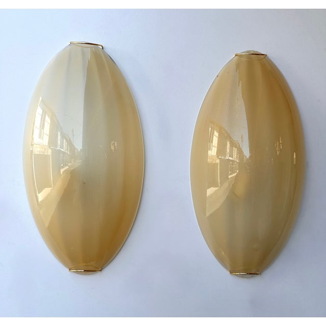 Contemporary Mid-Century Modern Space Age style set of 4 yellow Murano glass with gold leaf and brass wall lamps lights...