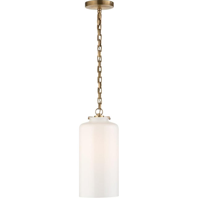 Katie Cylinder Pendant in Hand-Rubbed Antique Brass with White Glass Designer: Thomas O'Brien Canopy: 5.25" Round...