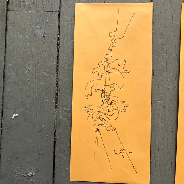 Contemporary original Wayne Cunningham pen and ink drawings set of two on vintage yellow envelopes. Signed. 5x11.5.