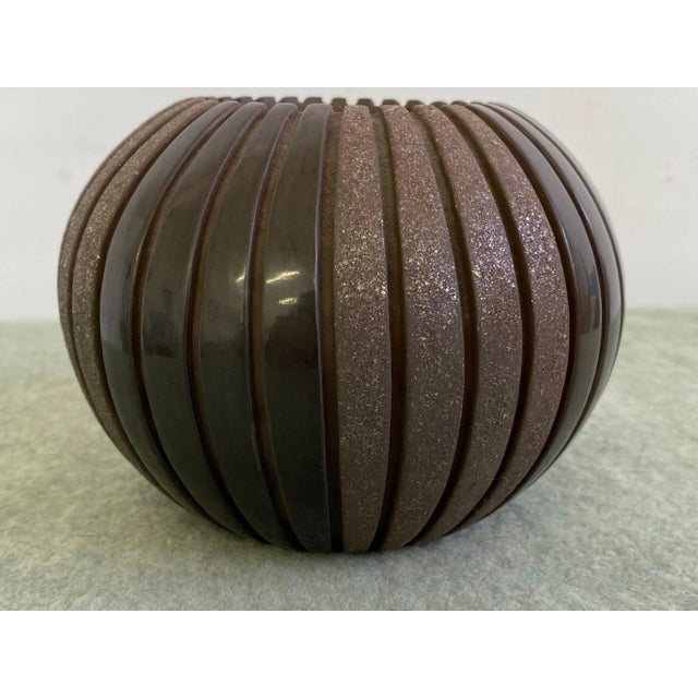 Sue Tapia heavily incised melon shaped bowl. Alternating highly polished with textured surfaces.