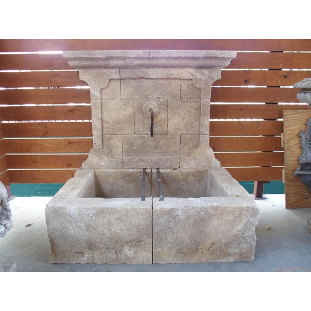 This elegant and large wall fountain is from the Provence region of France. Comprised of 17 pieces of hand-carved...