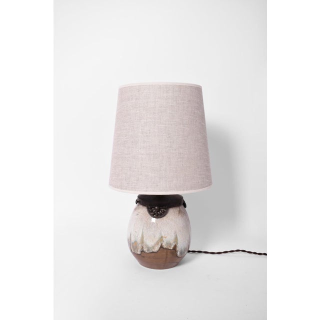 Art Deco style lamp in enamelled sandstone. Keramis. Height (cm): 23 Diameter (cm): 18 Up to 250V (Europe/UK Standard).The...