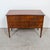 An exceptional 19th century French Louis XVI style commode sauteuse handcrafted of walnut by skilled artisans near...