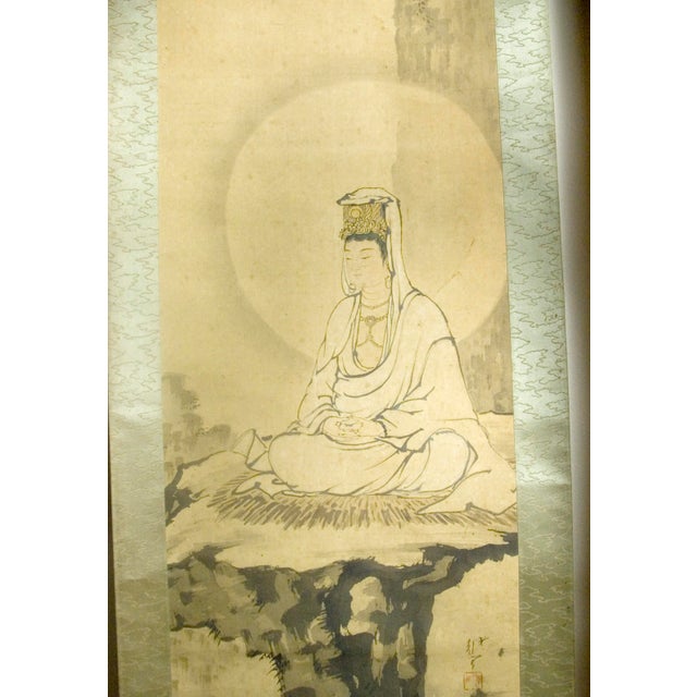 Japanese mountain throne Kannon scroll, colored inks on silk mounted on a silvery green silk brocade nakamawashi in a...