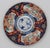 Circa 1860 Imari plate, Japanese. Large border reserves & fine geometric inner border. Pine trees, prunus, bamboo & cranes...