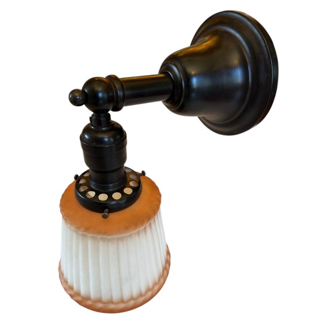 The perfect wall sconce for any room of the house that needs some great colorful charm. Original ribbed cased glass from...