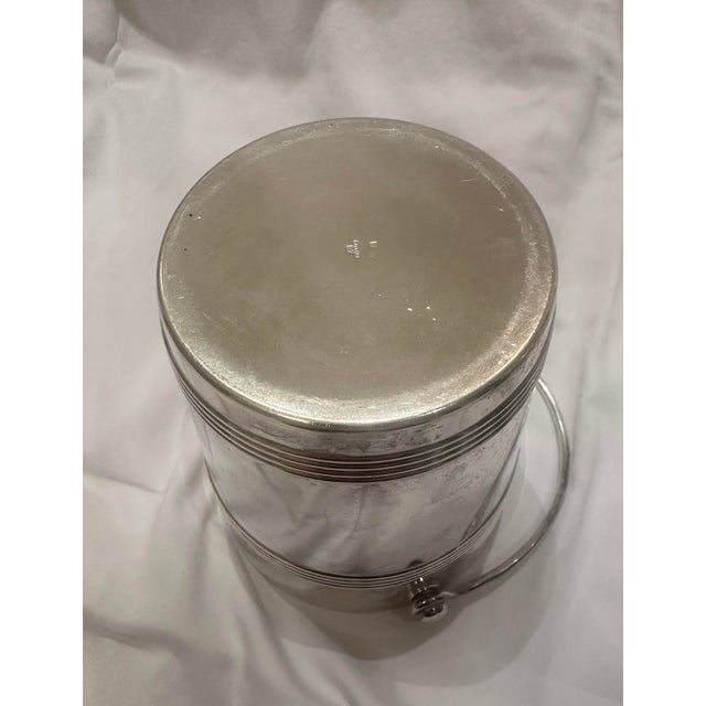 A Pair of silvered vintage Biarritz French Christofle/Gallia champagne and ice buckets. The smaller bucket is intended as...