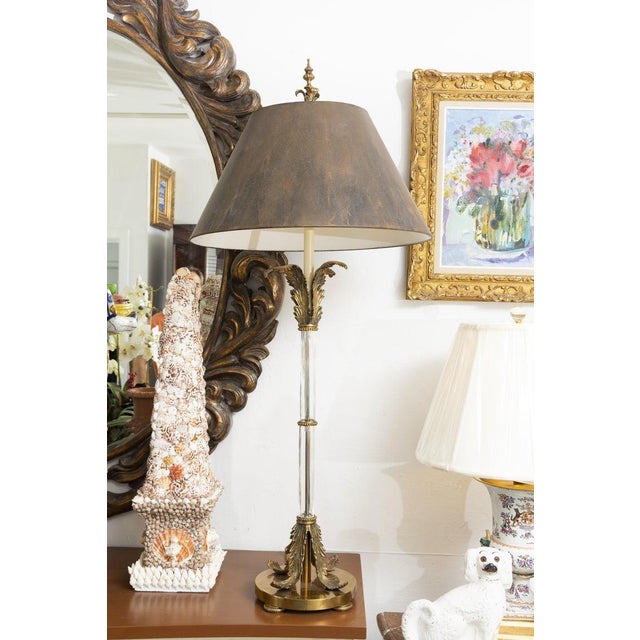 This is an elegant pair of neoclassical-style table lamps featuring slender, hand-cut crystal column standards accented...