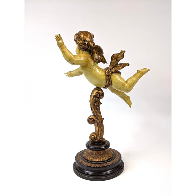 This Cupid stand is a lovely decorative item. It’s Vintage 1960s, hand carved and painted, and made of solid wood.