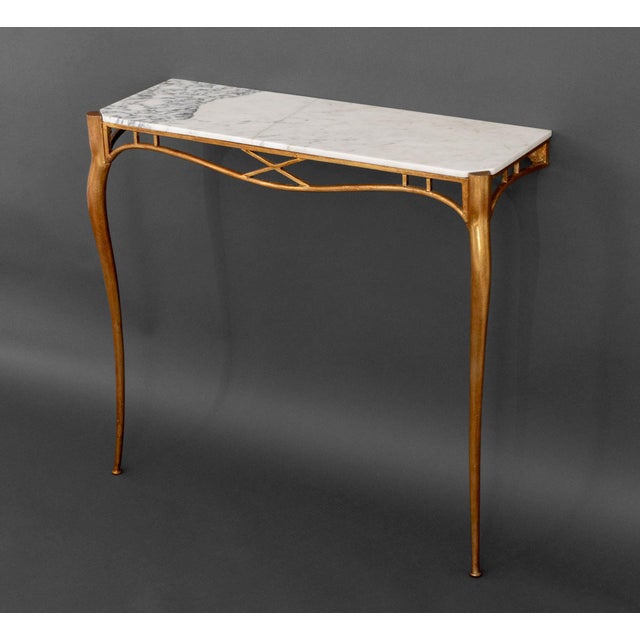 Italian White Marble Top Gilt Metal Wall-Mounted Console, 1940s. 29.25" H x 32" W x 11" D. Provenance: From a Forest Hills...