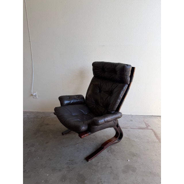 Iconic Kengu lounge chair in style of E. & N. Solheim, dating to the 1960s. This sculptural Scandinavian modern chair is...